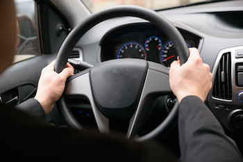 holding steering wheels correctly